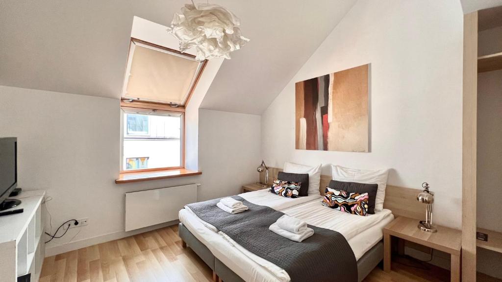 Posteľ alebo postele v izbe v ubytovaní Hotel77
