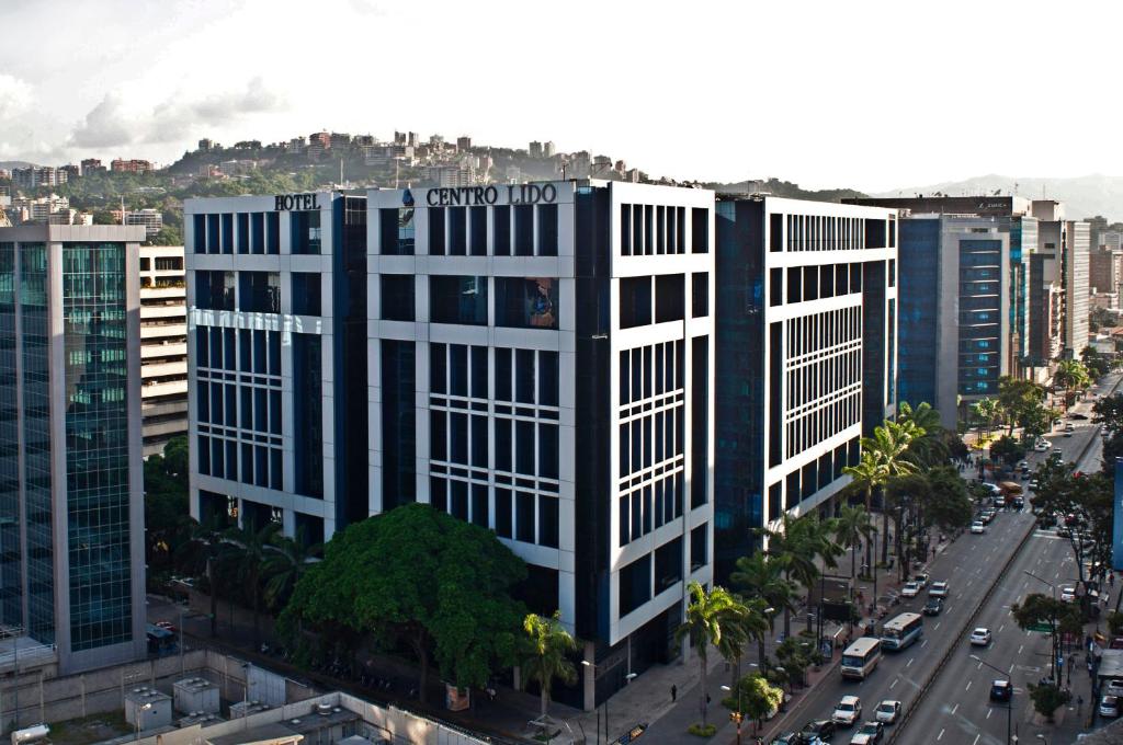 a tall building with the words grand hotel on it at Lidotel Caracas in Caracas