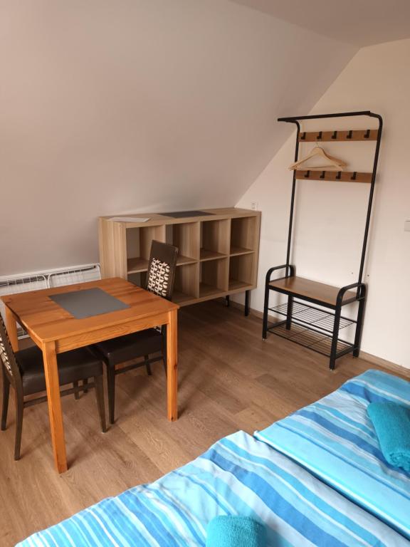 Postel nebo postele na pokoji v ubytování Vila Pavlínka apartmány Losiny