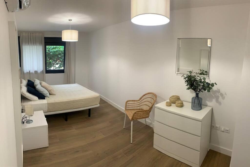 Posteľ alebo postele v izbe v ubytovaní Apartamento Central E