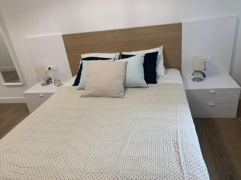 Posteľ alebo postele v izbe v ubytovaní Apartamento Central E