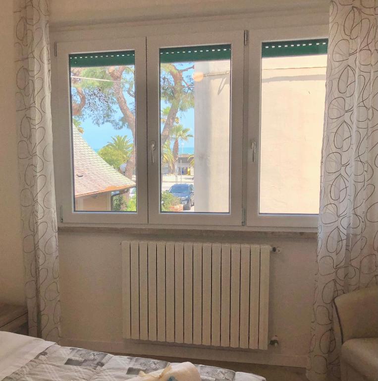 Łóżko lub łóżka w pokoju w obiekcie La Boa B&B