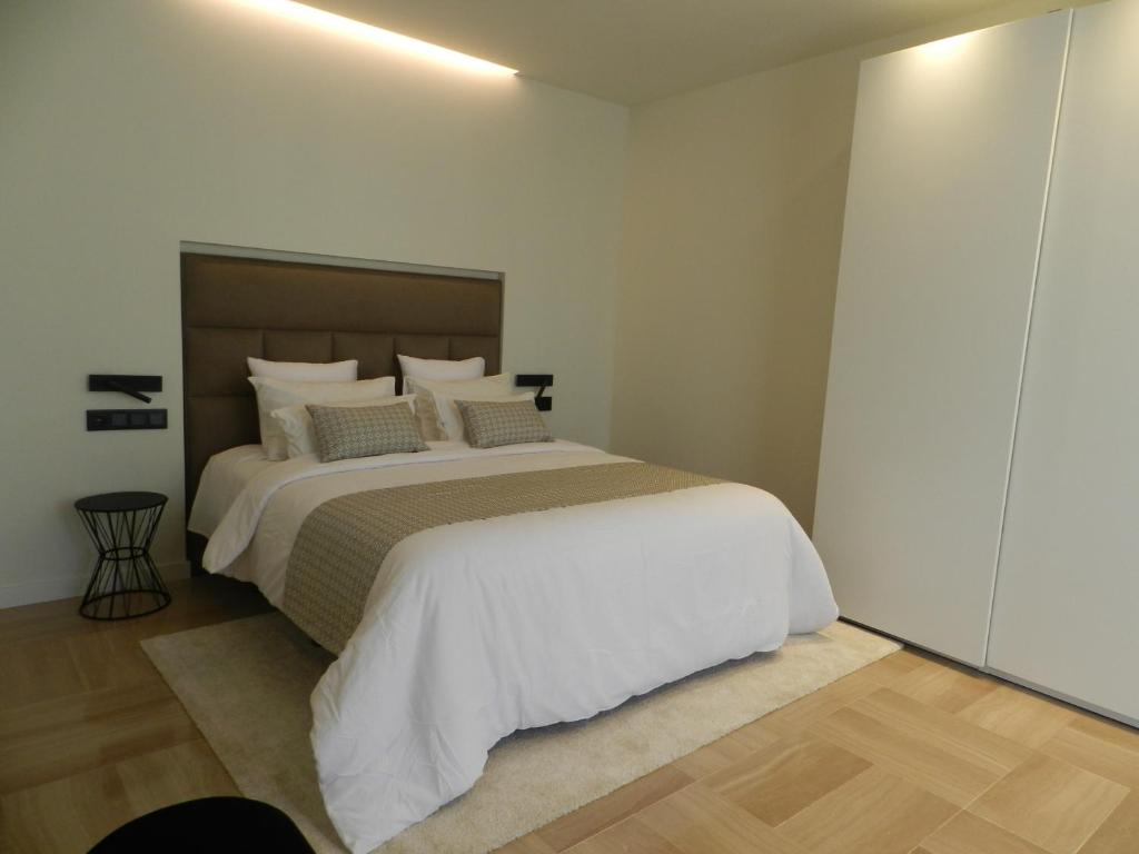 Postel nebo postele na pokoji v ubytování HOTEL MANEL