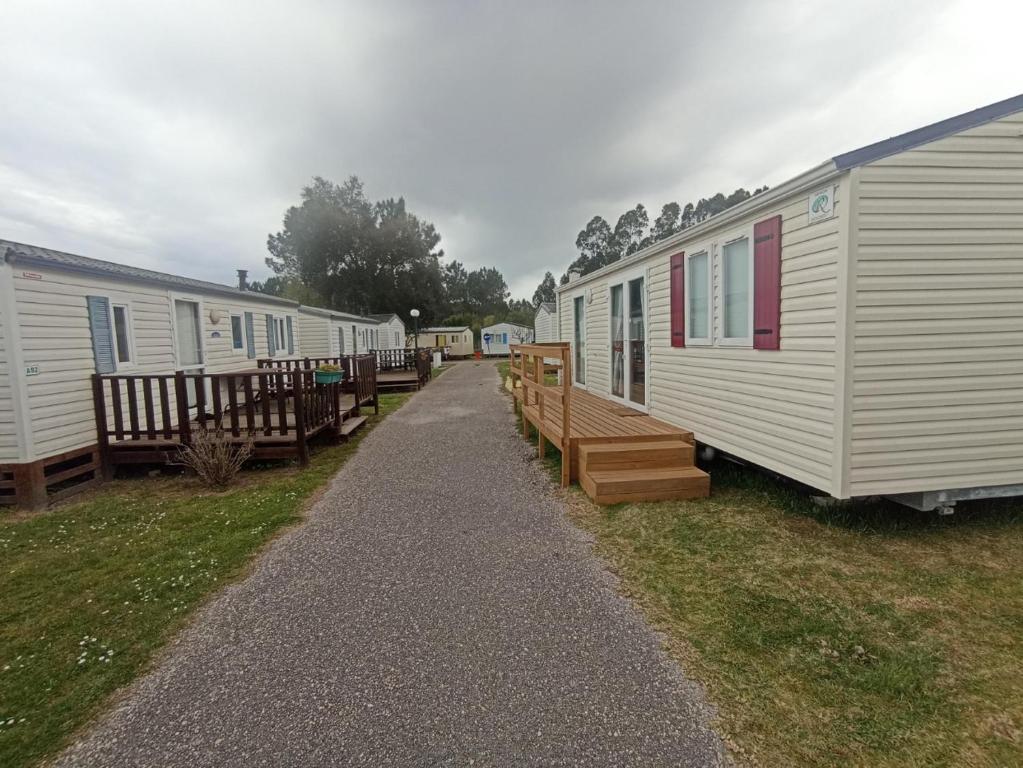 a row of mobile homes parked in a row at Casinhas Do Alentejano - Lands house Bungalows in Burinhosa