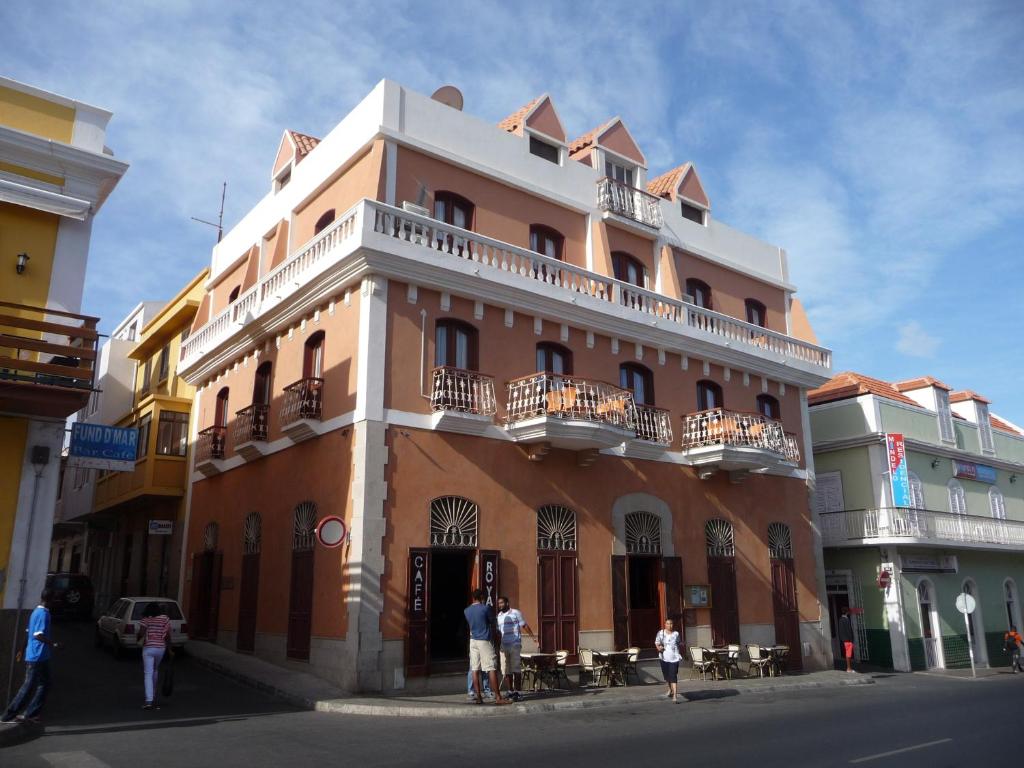 a group of people standing outside of a building at Royal Mindelo Suite in Mindelo