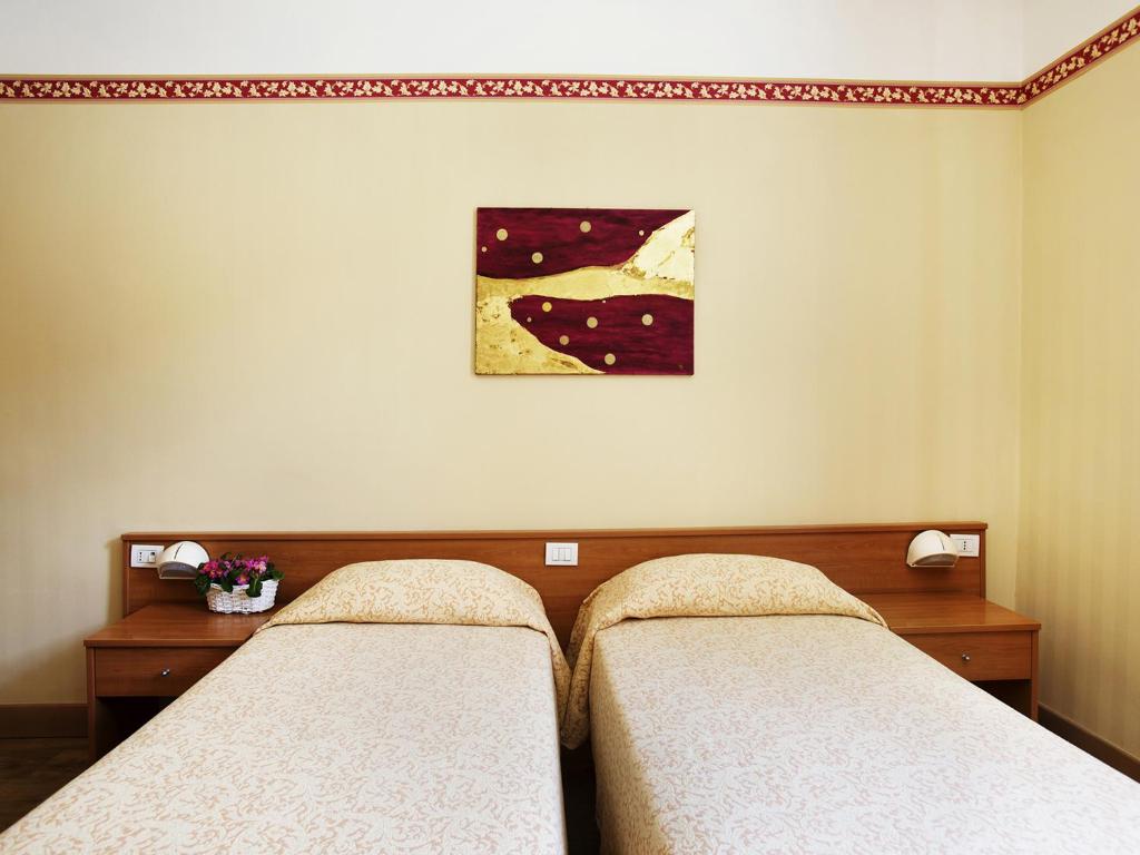 Postel nebo postele na pokoji v ubytování Hotel Fortuna