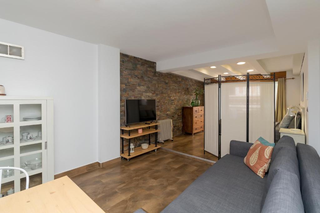 Televízia a/alebo spoločenská miestnosť v ubytovaní Loft con terraza centro Valencia