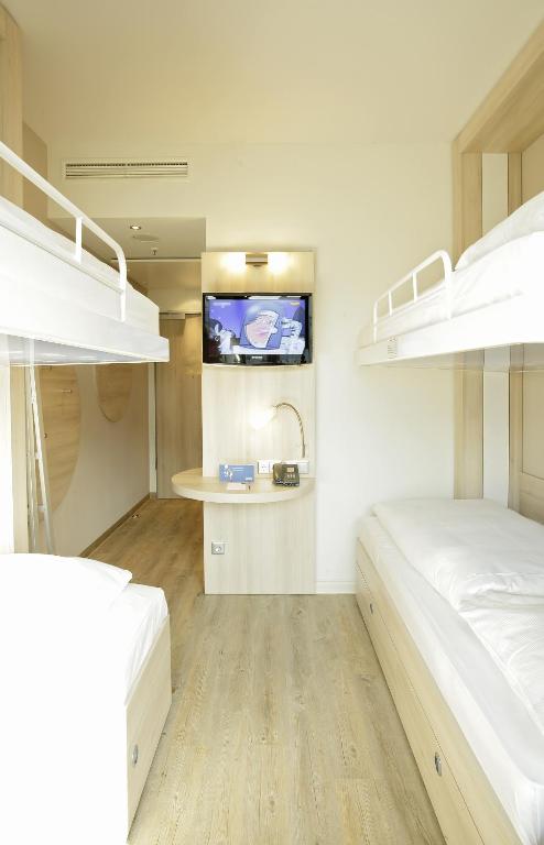 Postel nebo postele na pokoji v ubytování H2 Hotel Berlin-Alexanderplatz