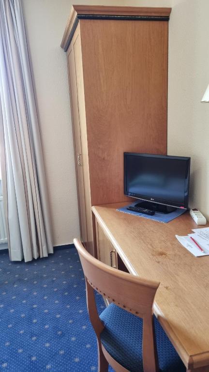 TV a/nebo společenská místnost v ubytování Residenzia Hotel Grenadier