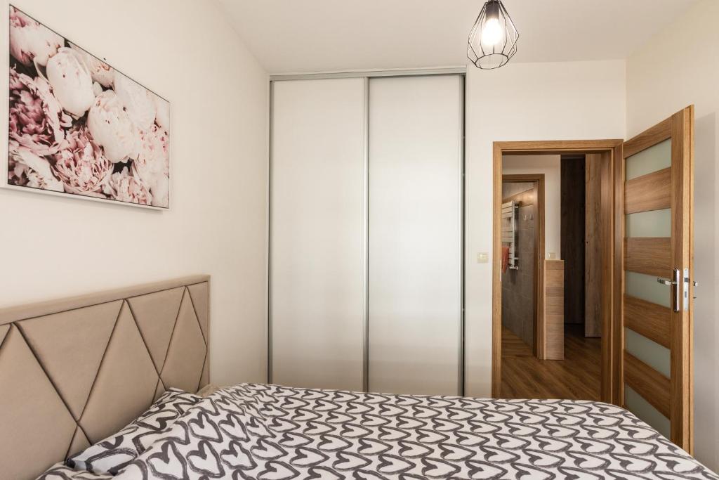 Posteľ alebo postele v izbe v ubytovaní Apartament 66 Zator