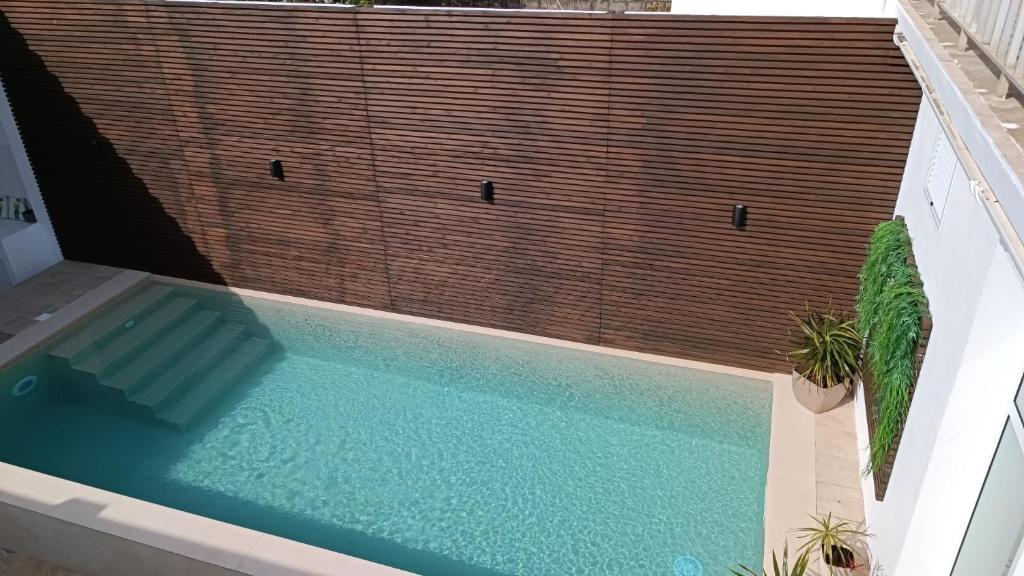 a swimming pool with at Casa do Penedo in Vila Franca do Campo