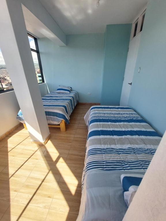 Un pat sau paturi într-o cameră la Disha's Home Casa Hospedaje