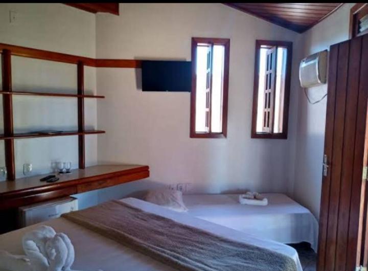 Postel nebo postele na pokoji v ubytování Pousada E Restaurante Doce Desejo