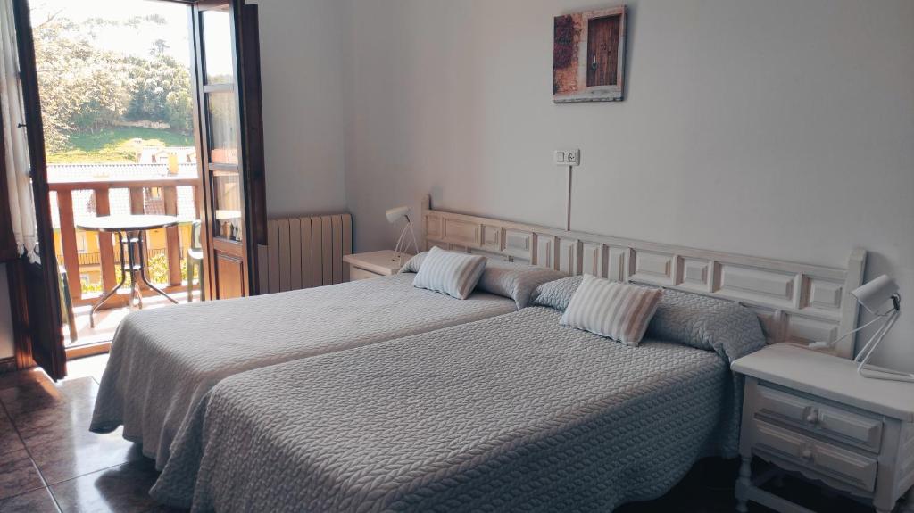 Cama o camas de una habitación en Hotel Solatorre
