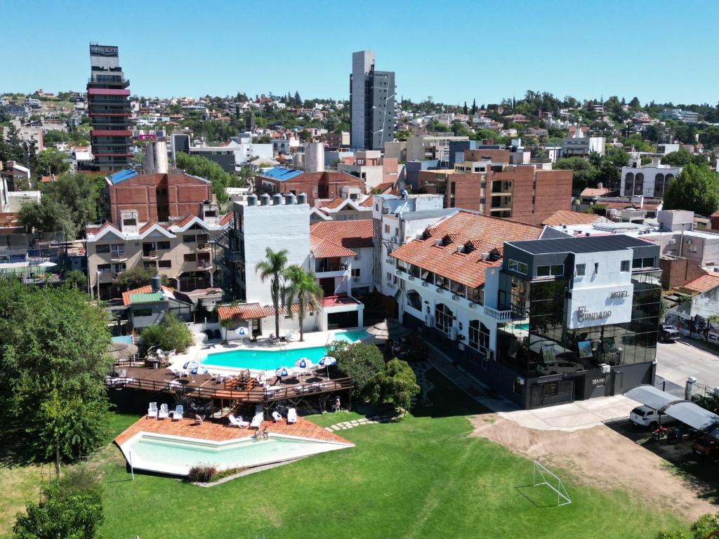 an aerial view of a city with a pool at Hotel El Condado in Villa Carlos Paz