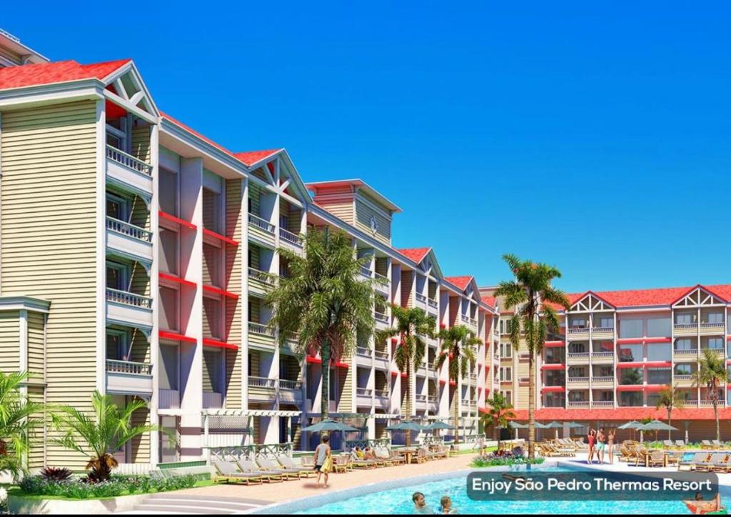 uma fila de edifícios de apartamentos ao lado de uma piscina em São Pedro Thermas Resort Parque em Águas de São Pedro