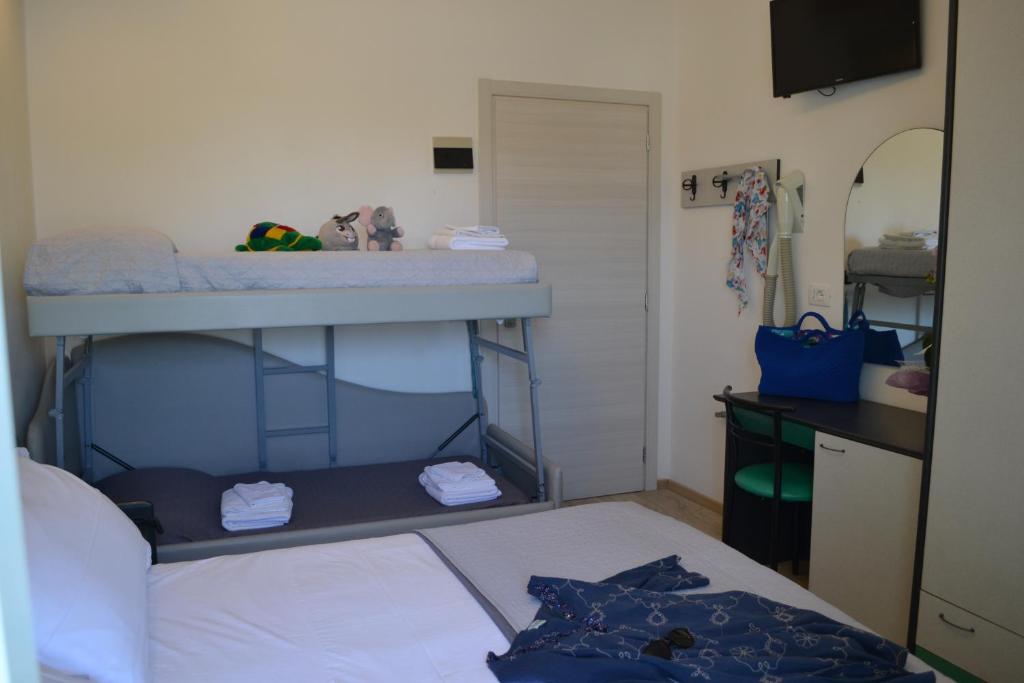 Postel nebo postele na pokoji v ubytování Hotel Tre Stelle