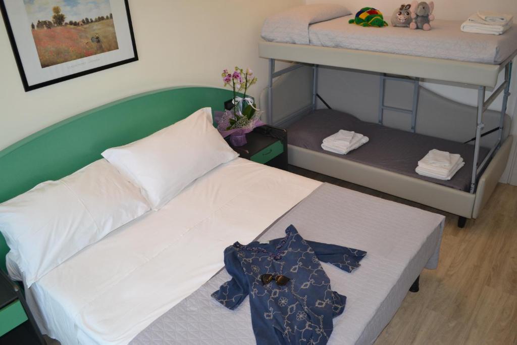 Postel nebo postele na pokoji v ubytování Hotel Tre Stelle