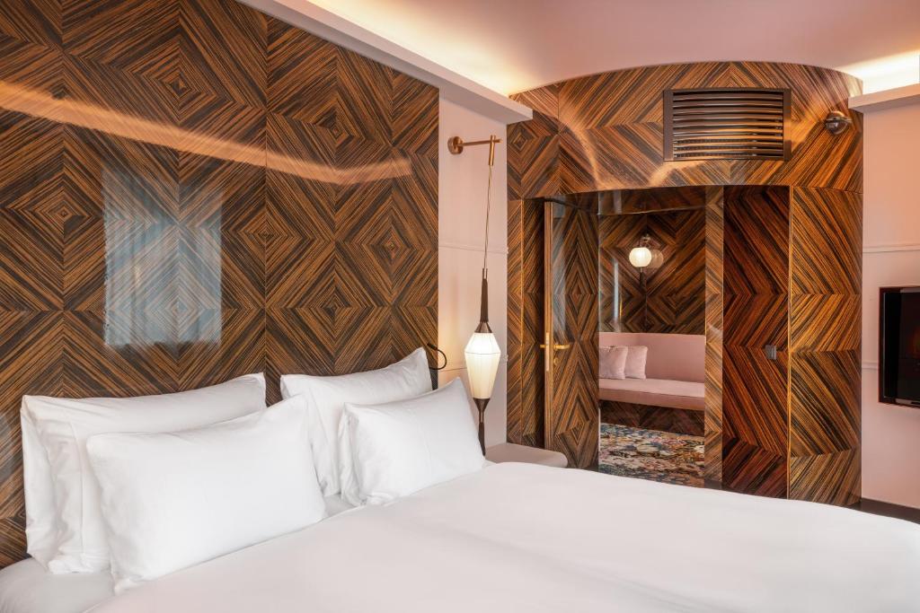 Postel nebo postele na pokoji v ubytování Hotel Topazz & Lamée