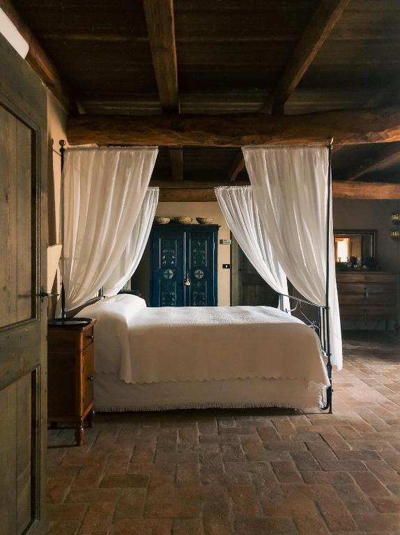 Postel nebo postele na pokoji v ubytování B&B Cascina Mattarelle