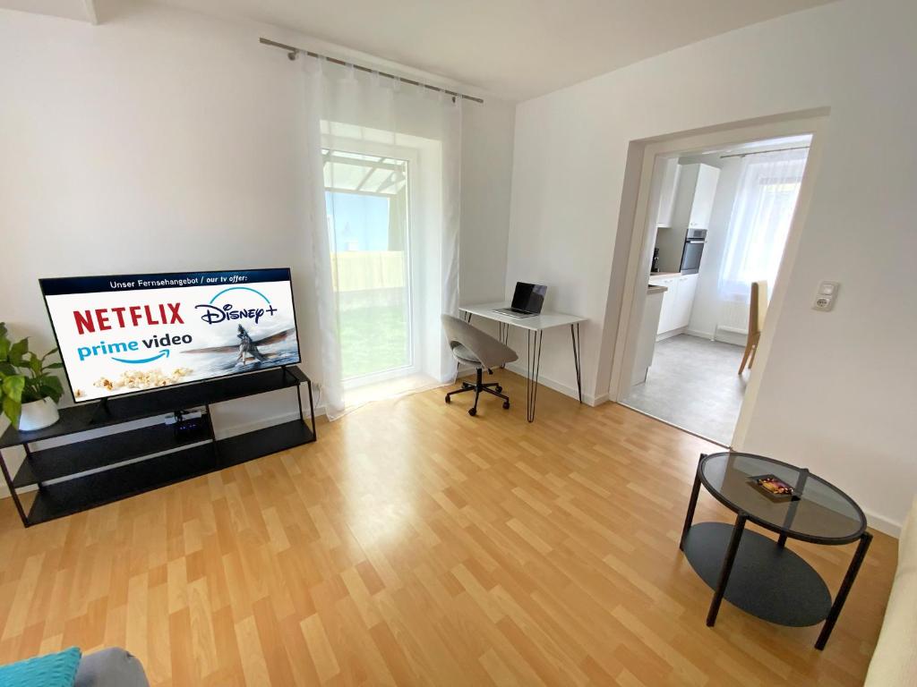 TV a/nebo společenská místnost v ubytování Jacky & Daniel's Apartments Top 1