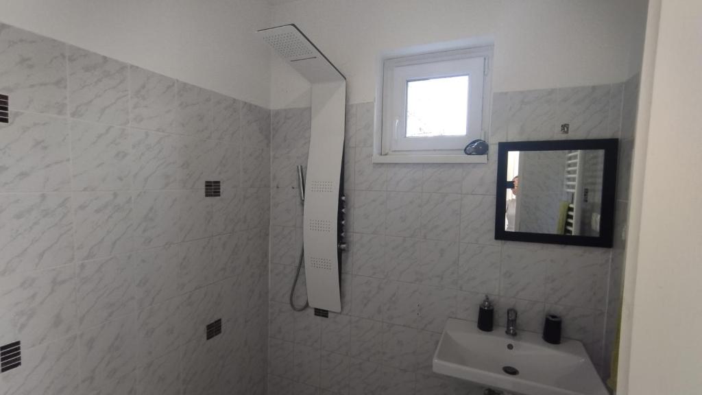 Kúpeľňa v ubytovaní Korona Apartman