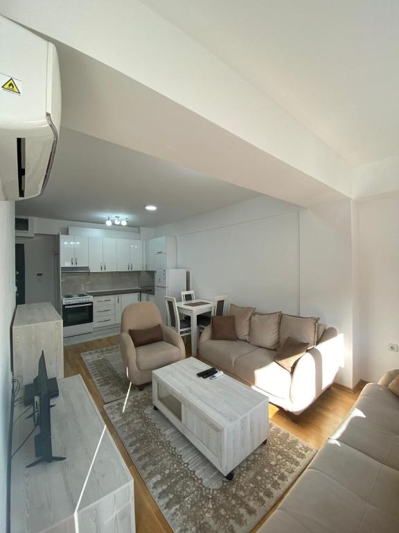 a living room with a couch and a table at srle home in Skopje