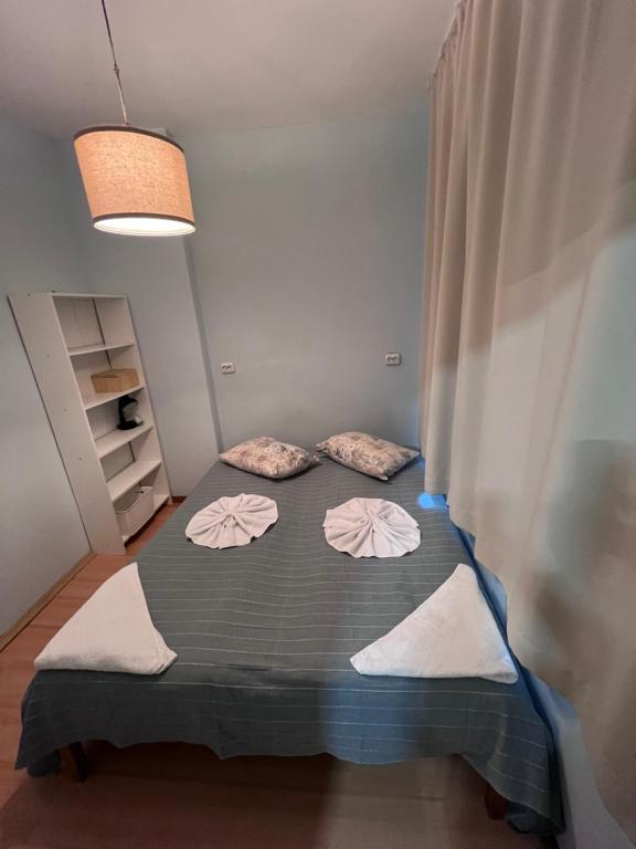 A bed or beds in a room at Apartment Saborni