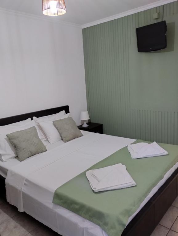 Postel nebo postele na pokoji v ubytování Studios Dimitraki
