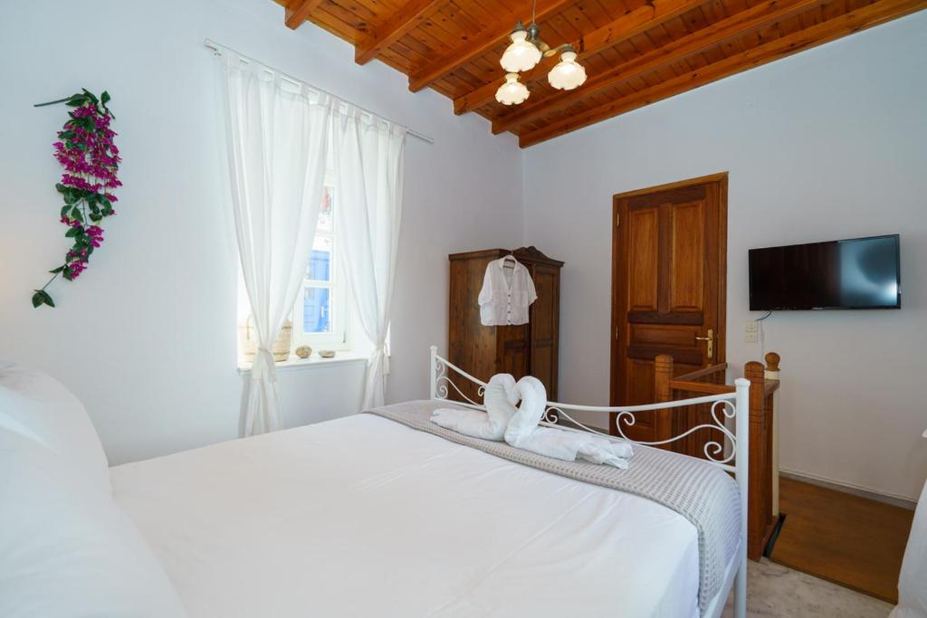 Postel nebo postele na pokoji v ubytování Captain D - Hydra Dream Houses