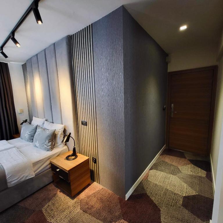 Postel nebo postele na pokoji v ubytování Hotel City View Deluxe