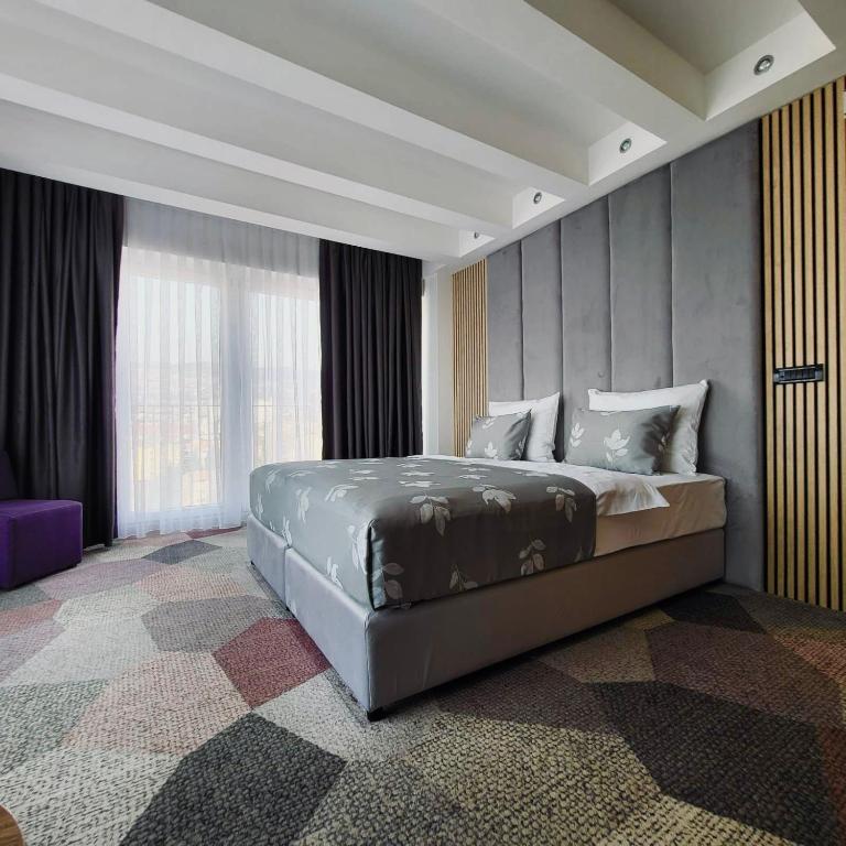 Postel nebo postele na pokoji v ubytování Hotel City View Deluxe