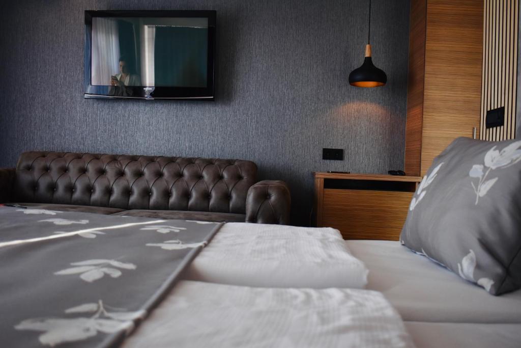 Postel nebo postele na pokoji v ubytování Hotel City View Deluxe