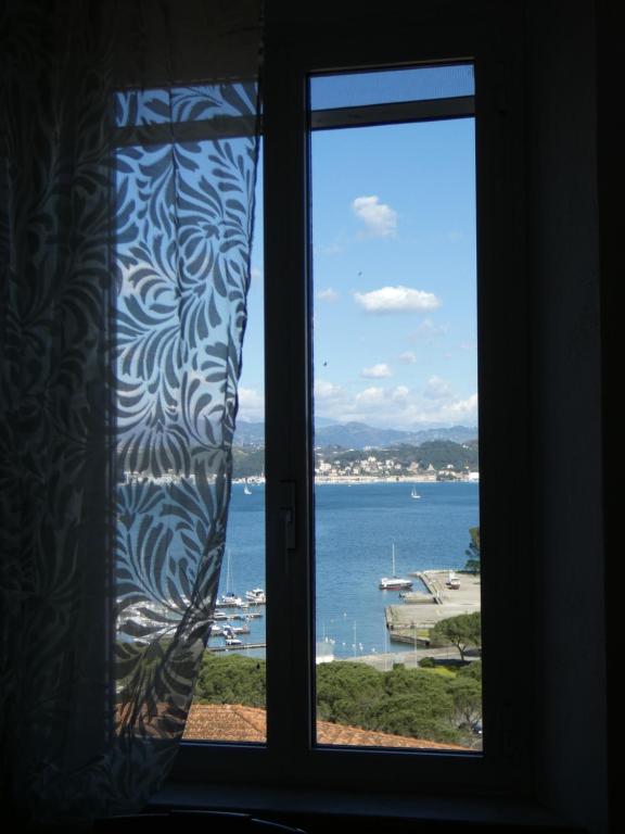 a window with a view of a body of water at CA' ARGENTINA Appartamento Vista MARE in La Spezia