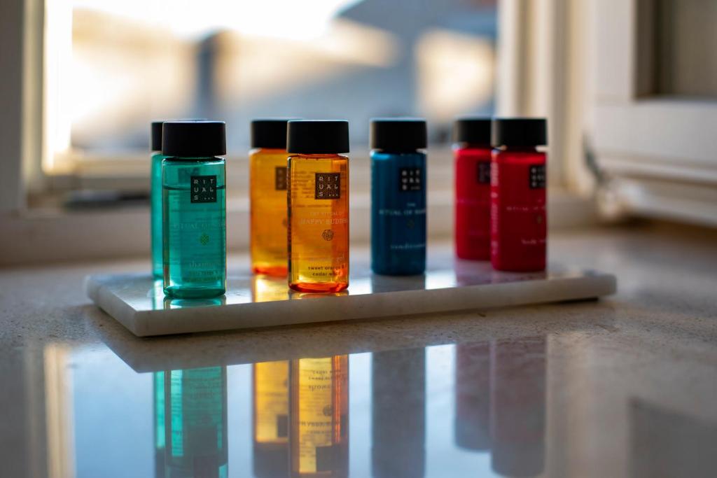 a group of four different colored liquids sitting on a table at Stayeva 11 in Dubrovnik