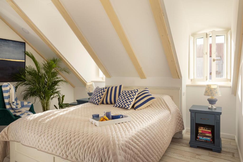 a bedroom with a bed with a tray on it at Stayeva 11 in Dubrovnik