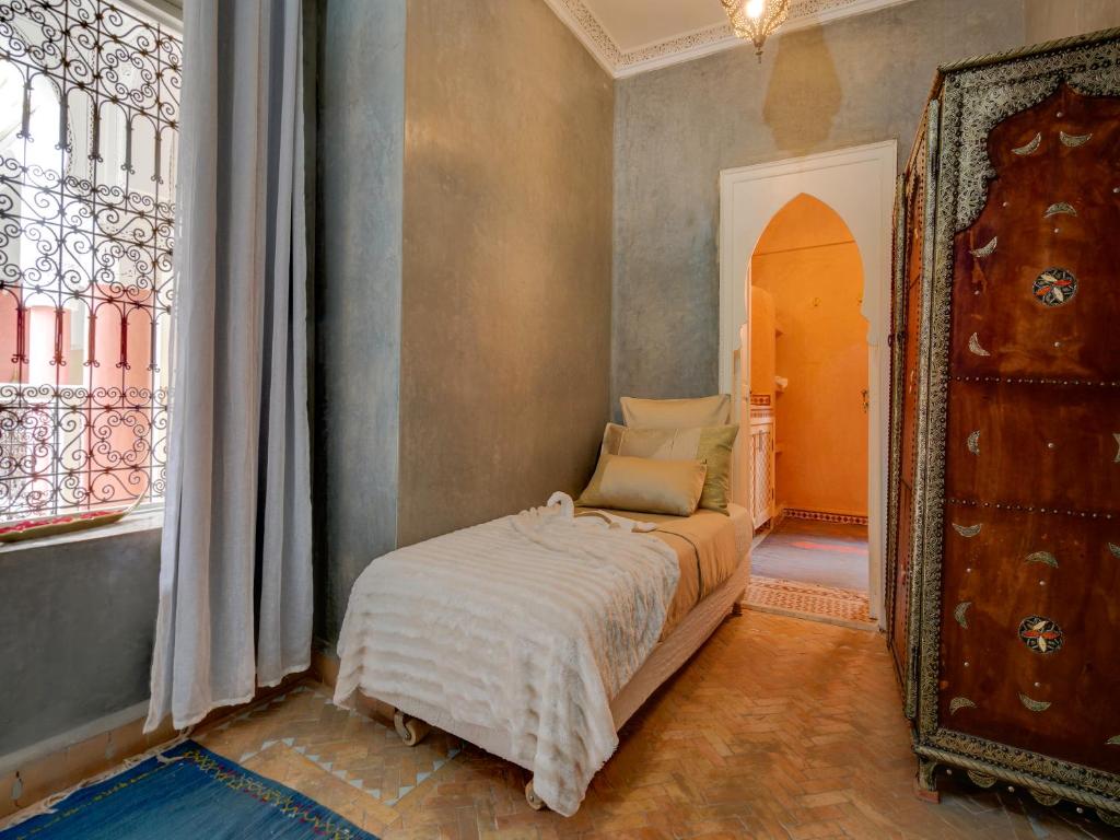 Postel nebo postele na pokoji v ubytování Riad Princesse Du Désert & Spa