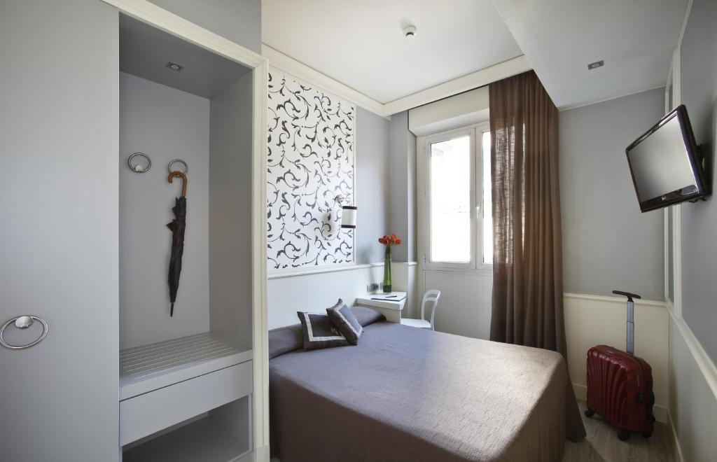 Łóżko lub łóżka w pokoju w obiekcie Hotel Golf