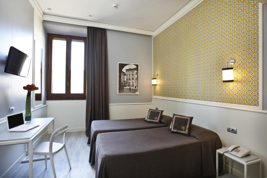 Łóżko lub łóżka w pokoju w obiekcie Hotel Golf