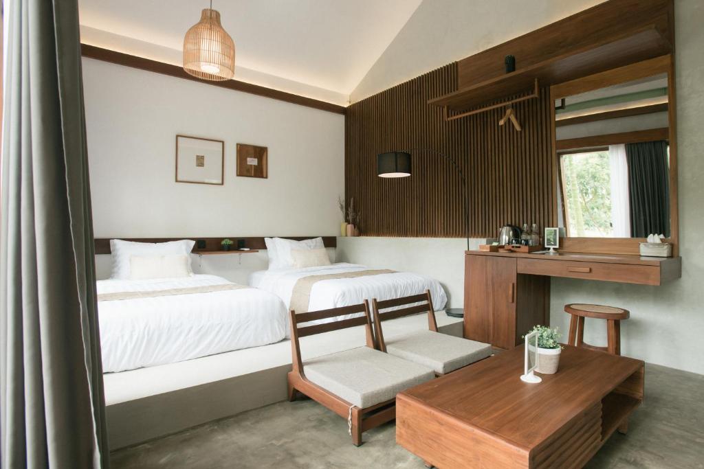 Postel nebo postele na pokoji v ubytování LAYANA FARMSTAY