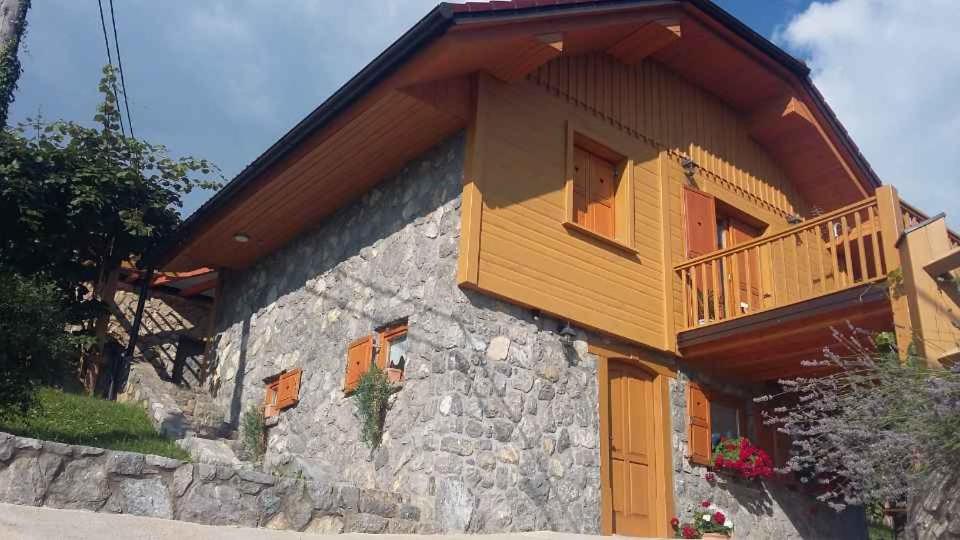 a house with a balcony on the side of it at Holiday home in Drganja sela Kranjska Krain 42002 in Drganja Sela