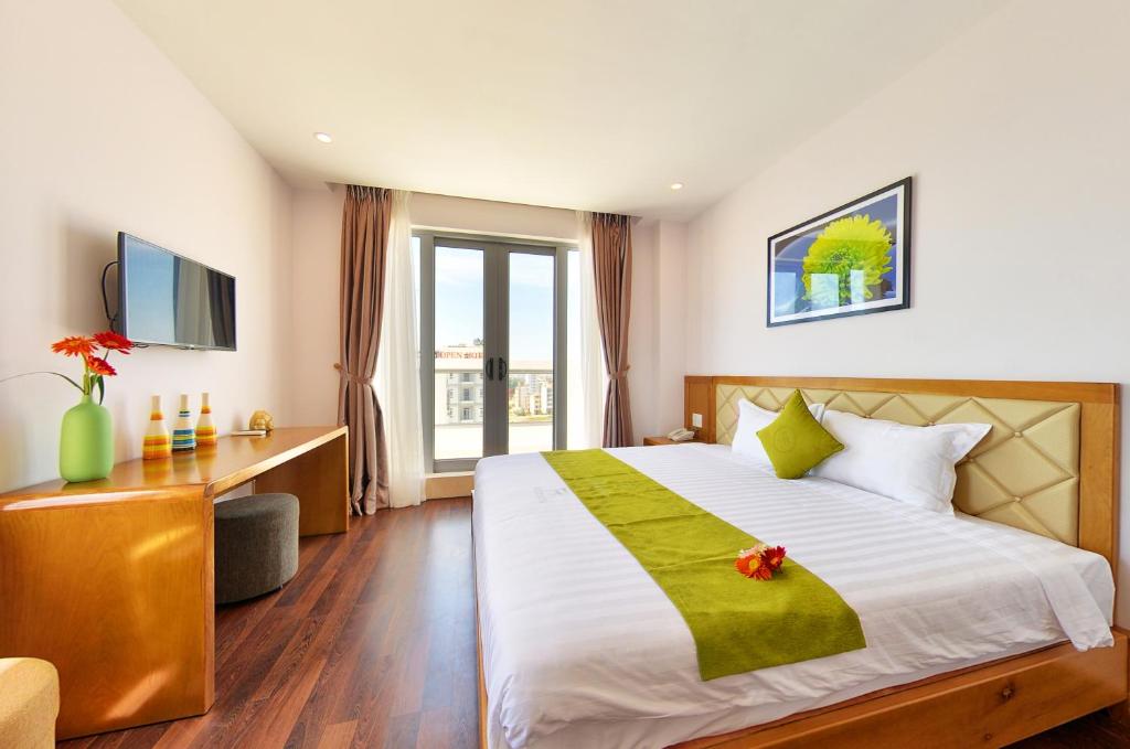 Postel nebo postele na pokoji v ubytování Richico Apartments And Hotel