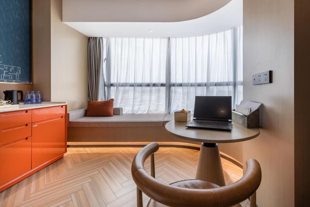 Posezení v ubytování Guangzhou Baiyun Airport MeHood Liz Hotel Free Shuttle Bus To Airport