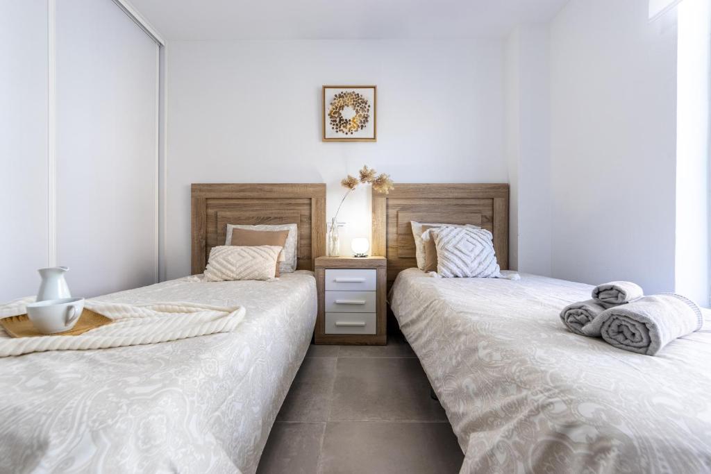 A bed or beds in a room at BOOOOM Apartment Salou Beach