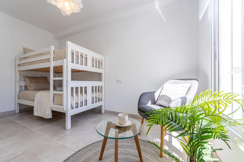 A bed or beds in a room at BOOOOM Apartment Salou Beach