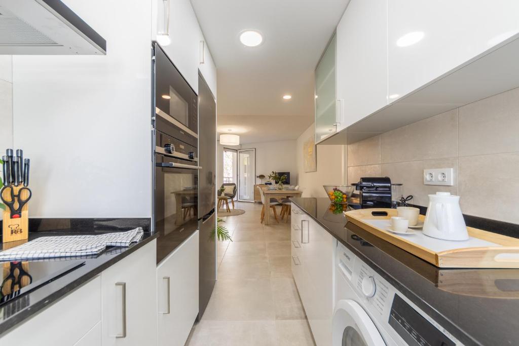A kitchen or kitchenette at BOOOOM Apartment Salou Beach
