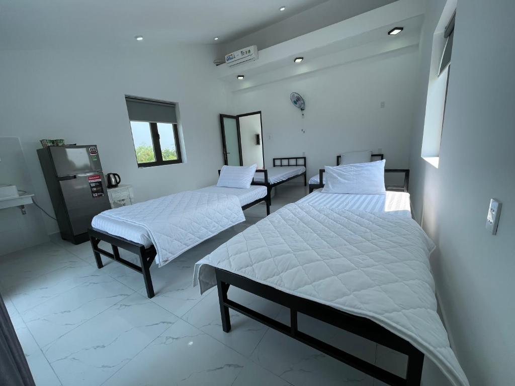 Postel nebo postele na pokoji v ubytování Moon house villa
