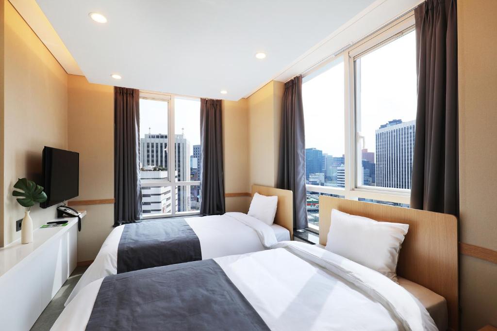 The Stay Classic Hotel Myeongdongにあるベッド