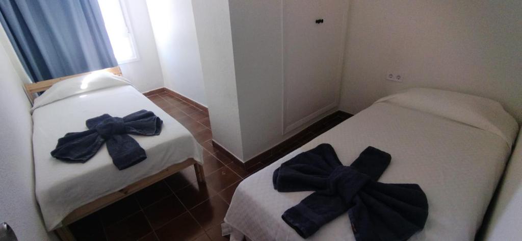 Posteľ alebo postele v izbe v ubytovaní Casa Mercedes 2 bedroom apartment Where beach and city meet BY NAMASTE ELITE