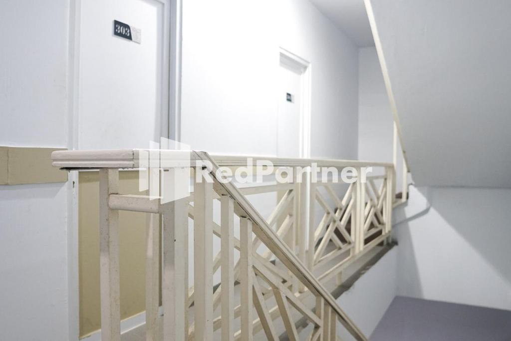Letto o letti in una camera di Cosmo Harmoni RedPartner